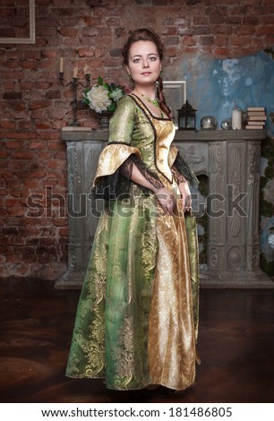 Beautiful woman in long medieval dress