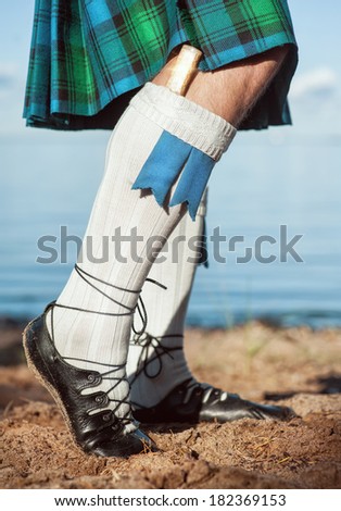 Legs of man in scottish kilt