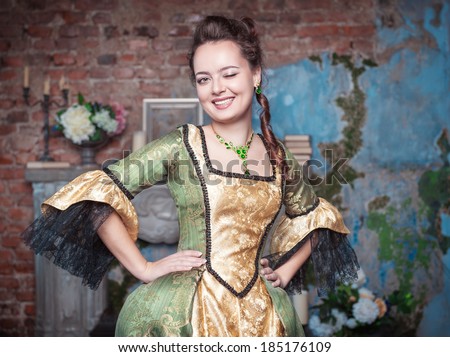 Beautiful woman in medieval dress winking