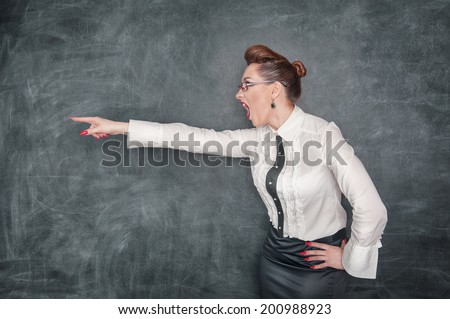 Angry screaming teacher pointing out