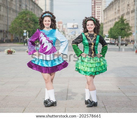 Two women in irish dance dresses