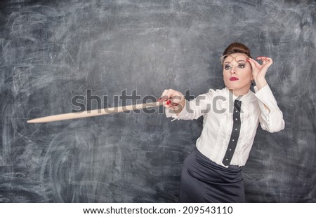 Strict teacher showing on something by pointer
