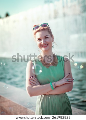 Happy beautiful young girl with braces in vintage clothing outdoor