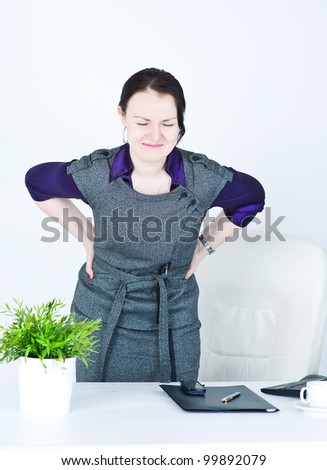 Business woman with pain in her back