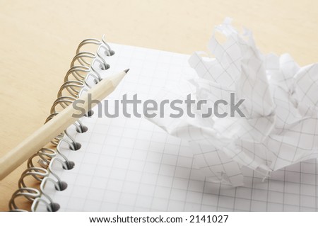 Crushed sheet of paper ripped of from notebook