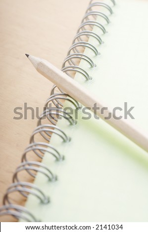 Pencil close up on the spiral notebook cover