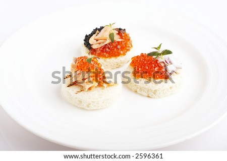 Salmon roe, sea weed roe, smoked salmon and onion on the toast