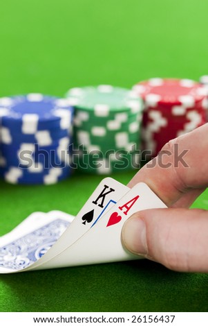 Playing poker in the casino with winning hand