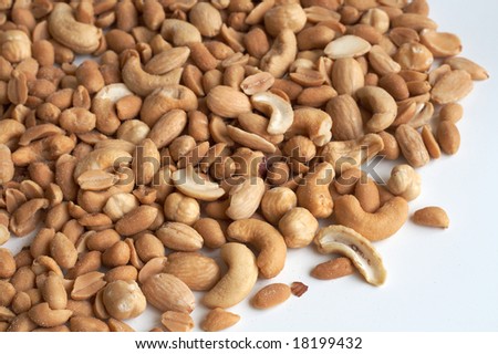 Mixed nuts and almonds close up with white background