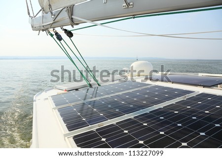 Solar charging batteries aboard a sail boat Photovoltaic panels energy concept