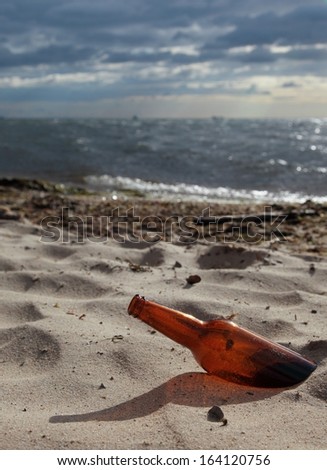 bottle on beach sea and sky. Garbage rubbish on nature, environment ecology