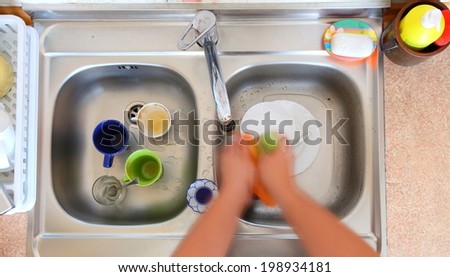 washing-up bowl in kitchen indoor cup person cleaning the sink