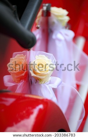 old red vintage car detail of red car door Bridal limousine handle with white decorations