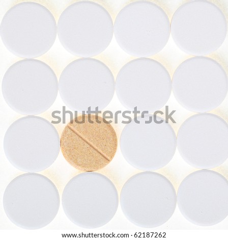 white big pills background - one pill stand out others