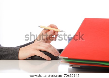 businesswoman - woman hand on mouse pen and computer. Pile of folders with old documents and bills. Isolated on white background