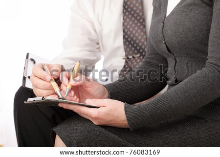 woman and man in grey write by pen on paper. Businesswoman signs. Isolated on white background