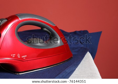 household chores - red iron  and navy blue shirt