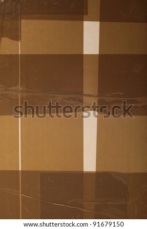 Side of Cardboard Box with Tape