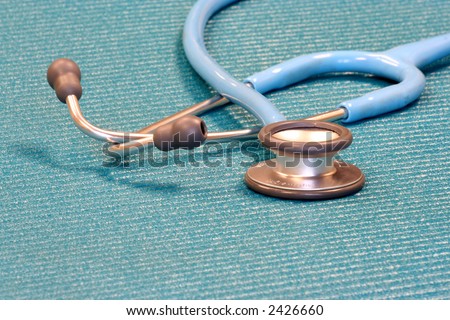 Stethoscope on examination mat