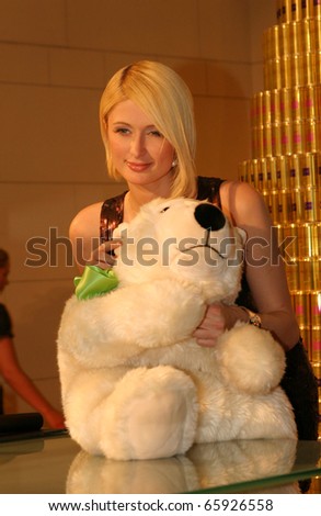 BERLIN - DECEMBER 14: Paris Hilton poses for photographers to promotes the Rich Prosecco at the KDW Shopping centre. December 14, 2007 in Berlin, Germany.
