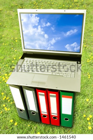 Open Air Digital Arrangement (Laptop On Binders Over Green Grass Background)