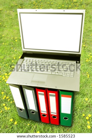 Open Air Digital Arrangement (Laptop On Binders Over Green Grass Background)