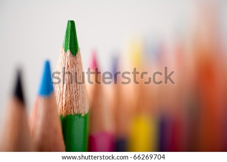Close-up picture of multicolor pencils. Very shallow focus on green pencil