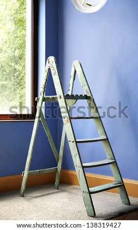 Home improvement with ladder and blue wall