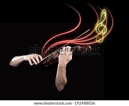 Hands playing  wooden violin with notes flying on black background