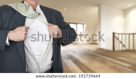 Businessman showing superhero suit underneath his shirt standing against clock with time for action - path for the shirt