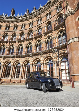 LONDON - JUNE 08 : A London Taxi or \'Black Cab\' at St.Pancras on June 08, 2014 in London, UK. All London cabs undergo a strict annual mechanical test before they are allowed to ply for hire.