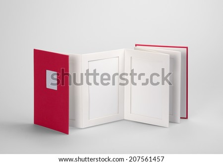 Blank book, photo album against a grey background with his shadow. Clipping path and path for each frame