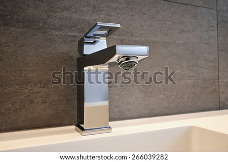 Very high end faucet, sink, and counter in a luxury bathroom - no water