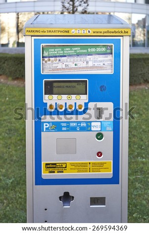 BRUSSELS, BELGIUM - APRIL 15, 2015: Brussels powered solar parking meter. Parking solutions have been growing in importance to deal with increasing congestion of parking spaces.