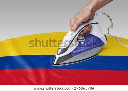 Steam iron for smooth out the wrinkles of Flag from Colombia