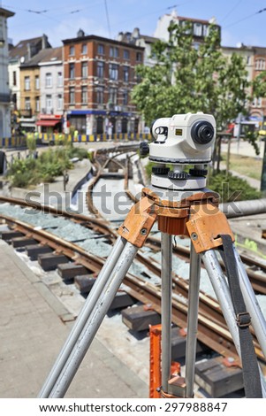 BRUSSELS, BELGIUM -16 JULY 2015: Land Surveying on construction site and some workers repair and replace rail trams in Brussels at Verboekhoven square in Schaerbeek.