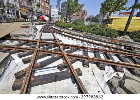 BRUSSELS, BELGIUM -16 JULY 2015: Some workers repair and replace rail trams in Brussels at Verboekhoven square in Schaerbeek.