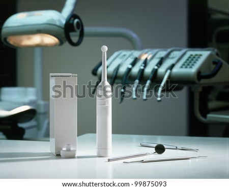Electric toothbrush, dental practice background