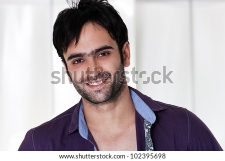 close up of a happy man wearing collared shirt