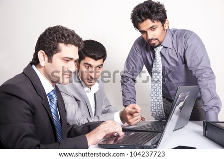 small group of young multiracial businessmen in office meeting