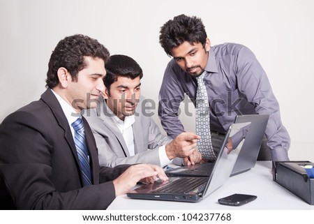 small group of young multiracial businessmen in office meeting