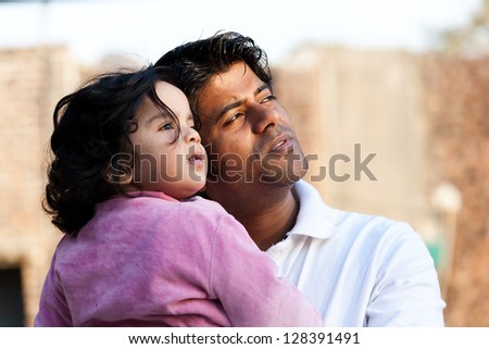 close up of father and daughter, Indian man with his one year old daughter