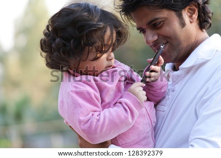 father and daughter using PC tablet, Indian man with his daughter