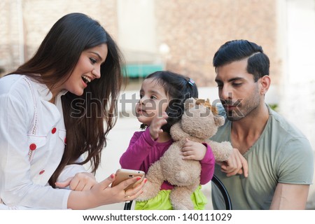 multi racial family of three in outdoor, Indian family