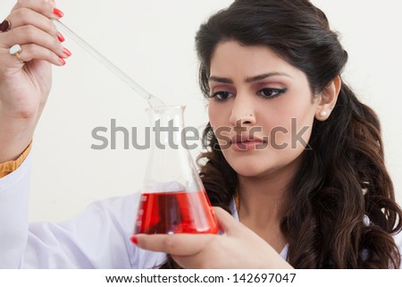 female scientist performing scientific test, Indian Scientist doing research work