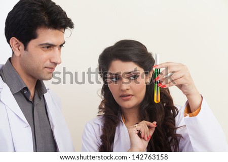 male and female scientist sharing results after successful results.