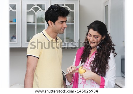 husband and wife in the kitchen, Indian couple in the kitchen