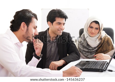 Arab Business Woman In A Meeting With Colleagues, Three Business People In The Meeting, Ethnic Business People, Business Team.