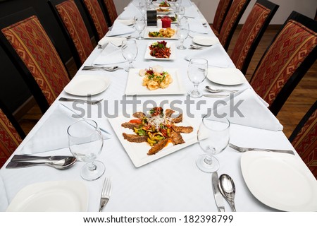 dining table set up with different kind of dishes
