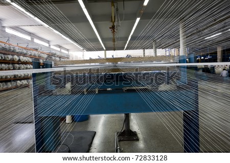 weaving machine at a textile mill.